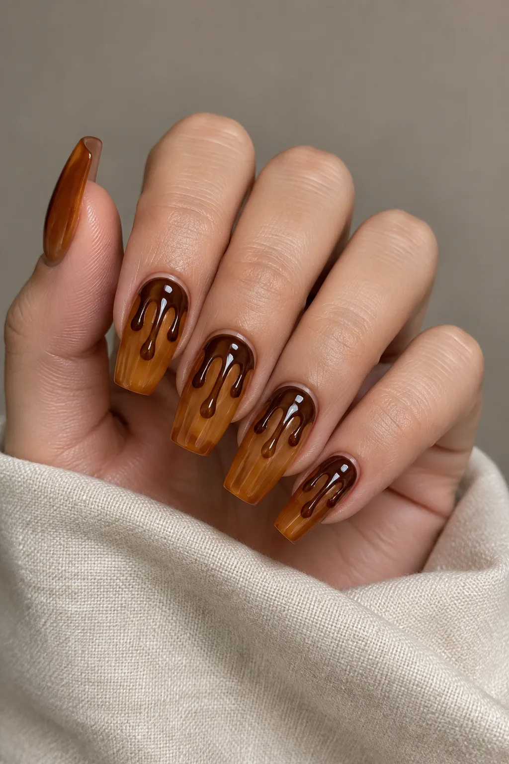 Medium coffin nails with amber maple syrup drip art over a nude base