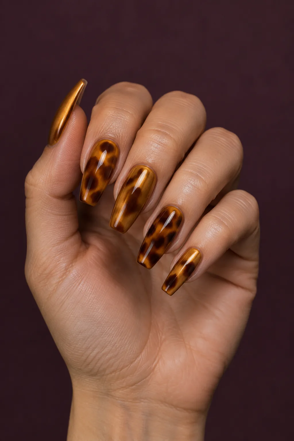 Amber chrome tortoiseshell nails with mirror shine on ballerina nails
