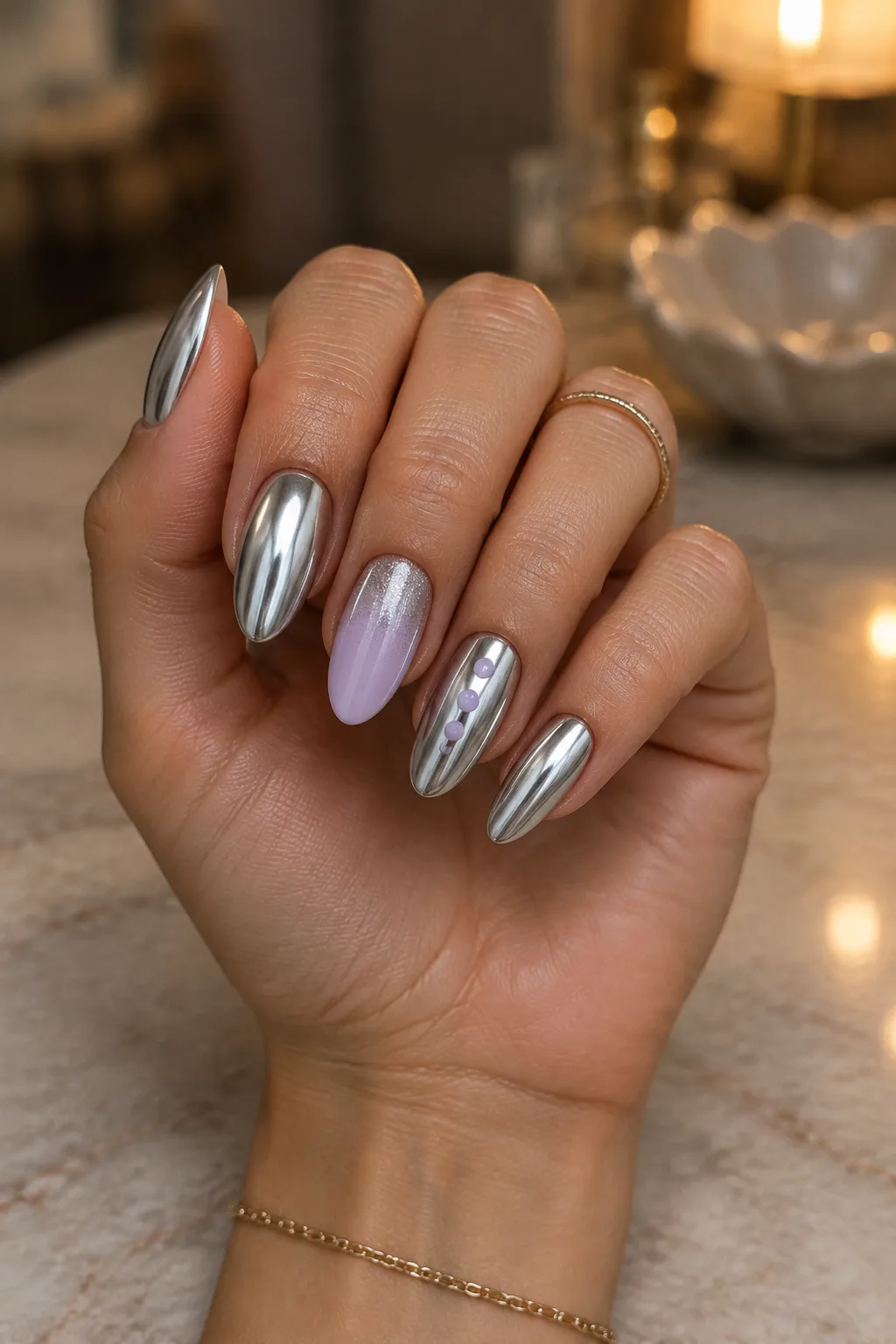 Silver chrome and lilac nails held in daylight to check the color
